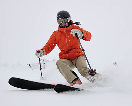 Person skiing in the snow wearing ski socks