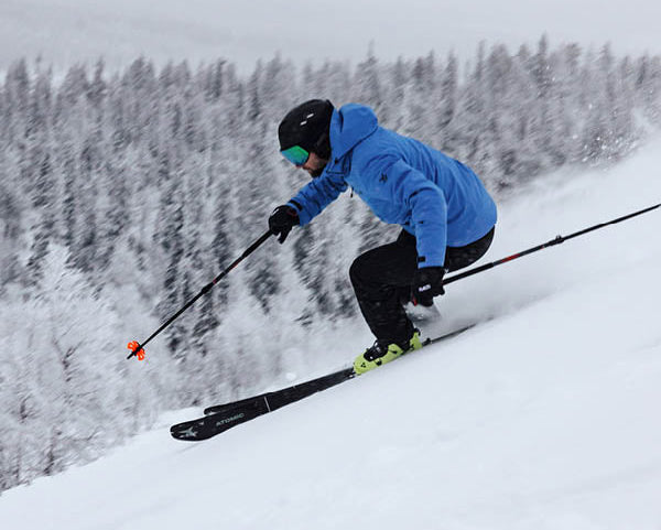 Person skiing  downhill in the snow wearing ski socks